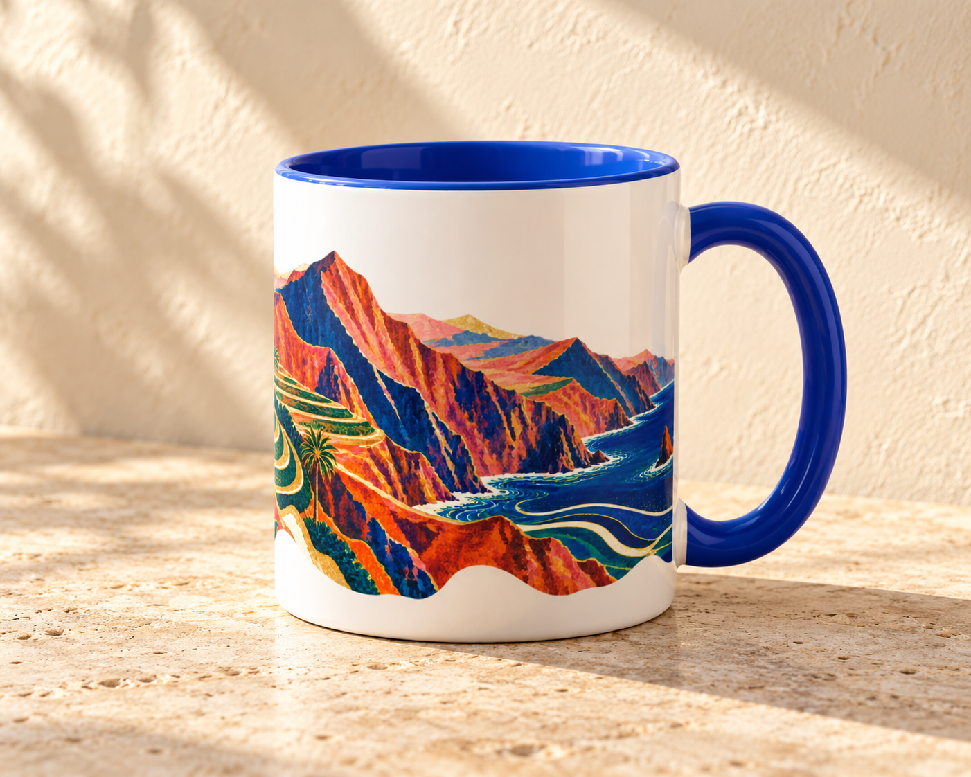 White Valle Gran Rey ceramic mug with blue handle and interior and colorful cliff and sea artwork